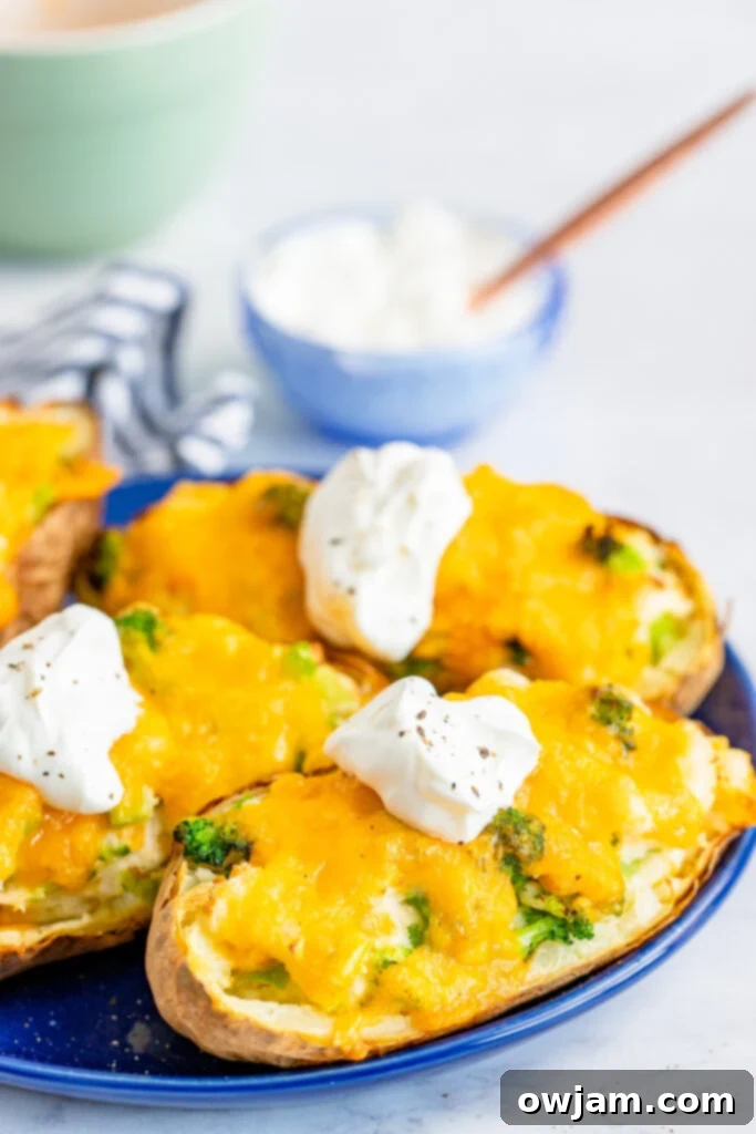 Perfectly golden Air Fryer Twice Baked Potato served on a blue plate