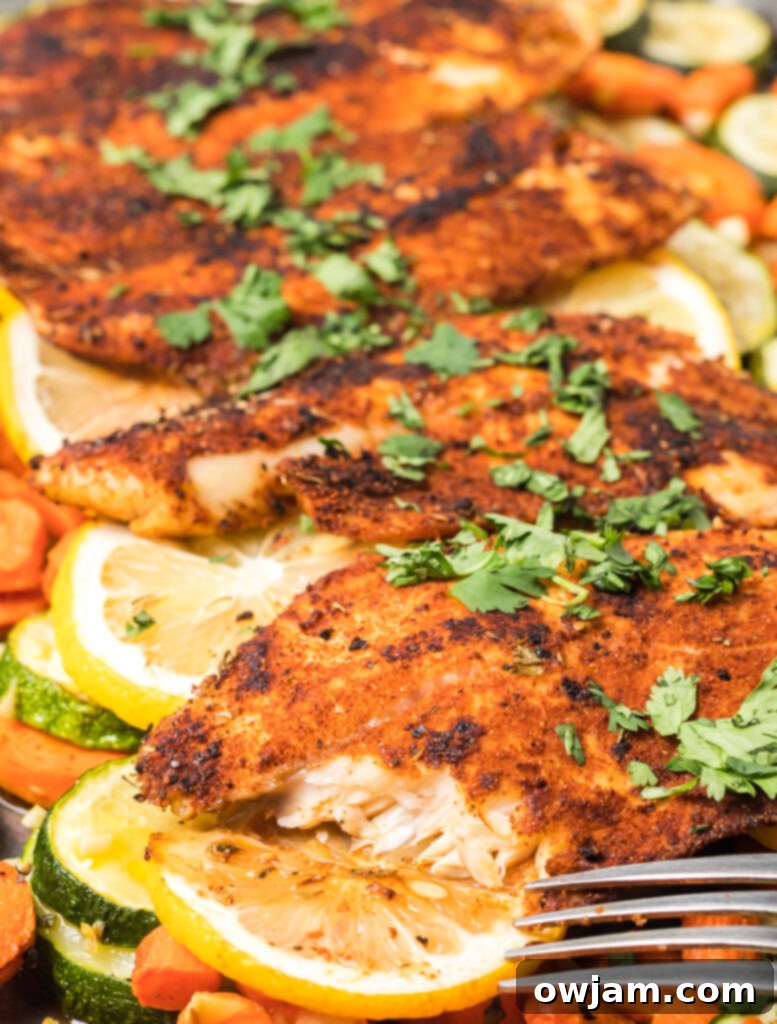 Easy Blackened Fish with fork ready to eat