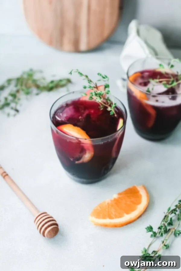 Your New Favorite Red Sangria 2 Close-up of sparkling red sangria in glasses with orange slices