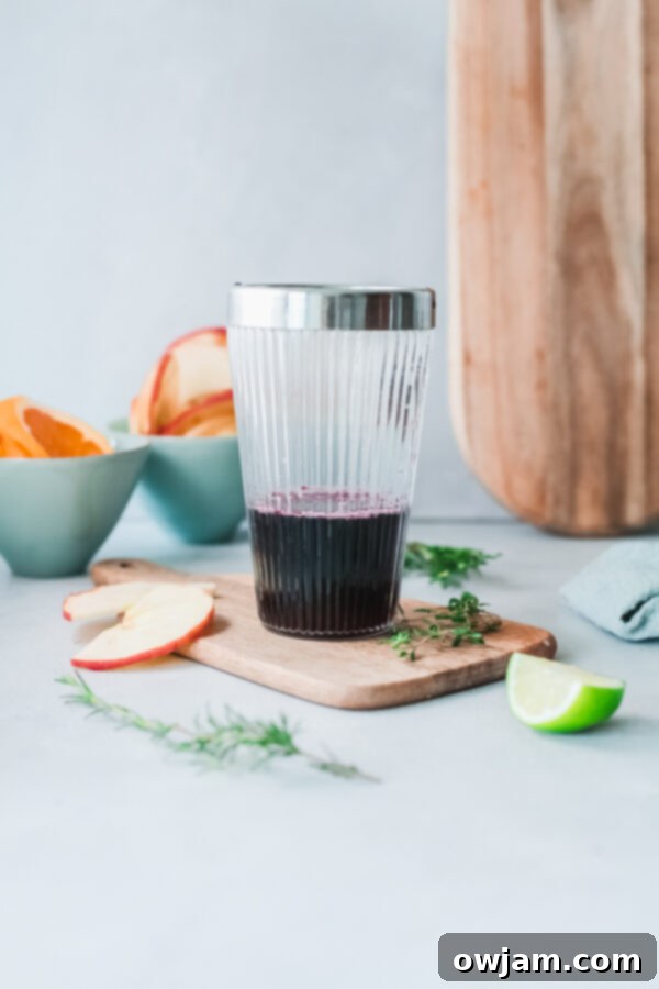 Your New Favorite Red Sangria 6 Ingredients for Red Sangria being combined in a pitcher