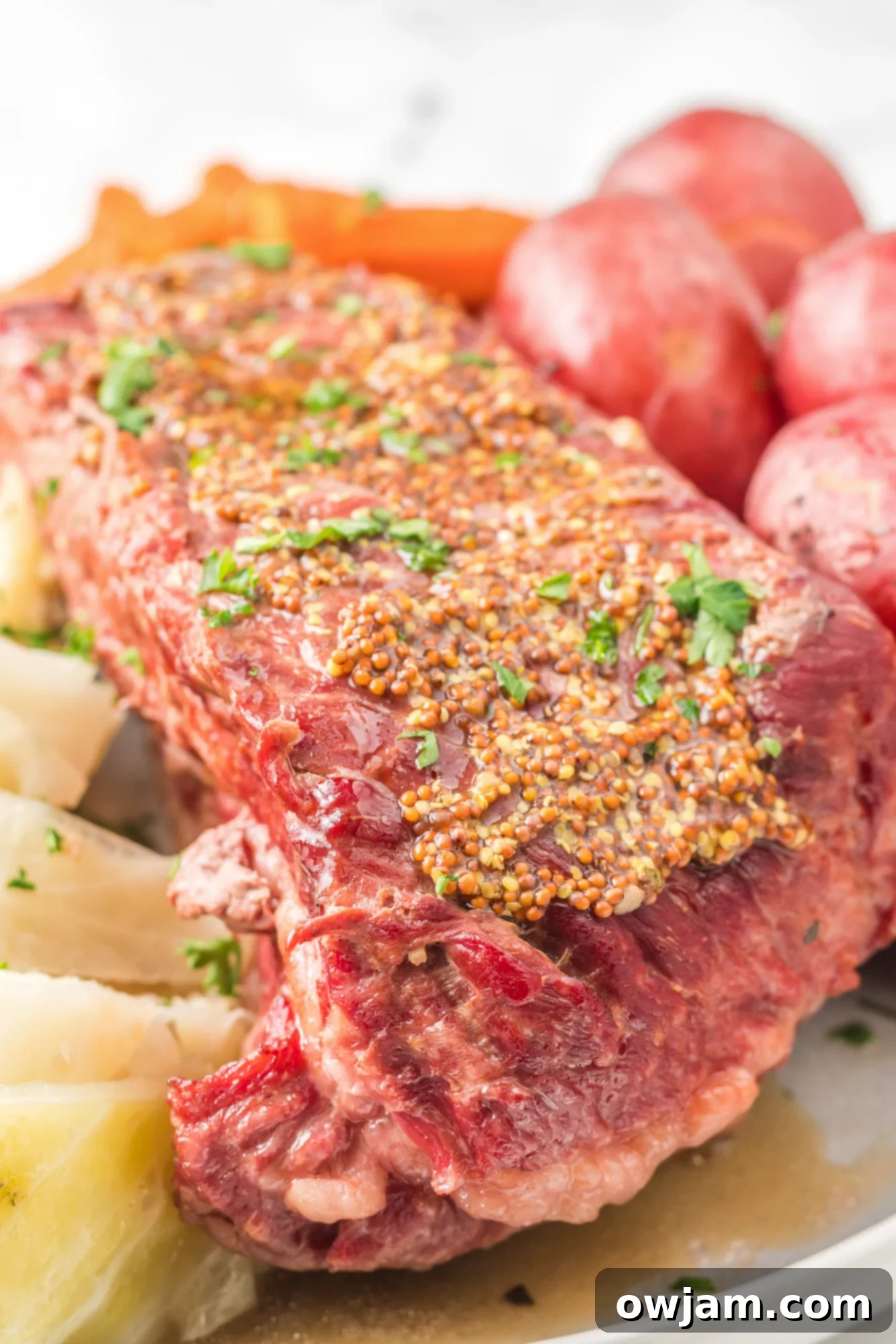 Tender Instant Pot Corned Beef and Cabbage 6 Sliced Instant Pot Corned Beef and Cabbage garnished with mustard and parsley
