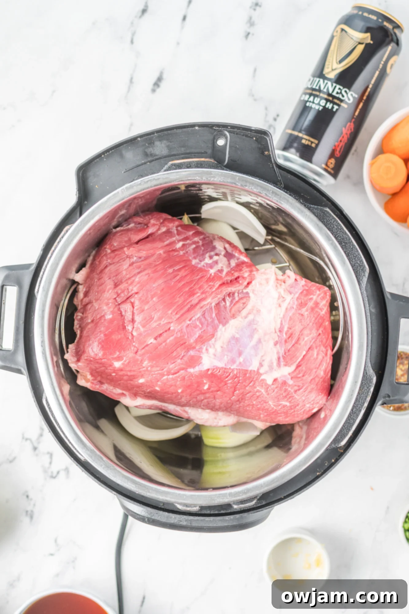 Tender Instant Pot Corned Beef and Cabbage 8 Corned beef brisket with seasoning packet in the Instant Pot