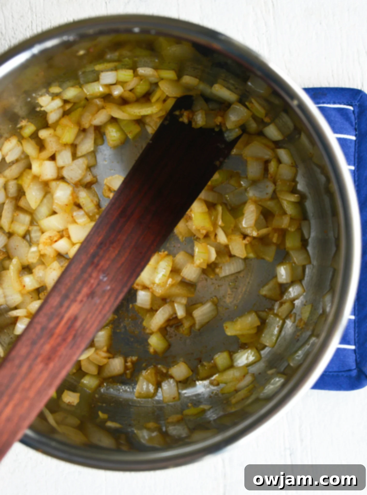 Instant Pot Cauliflower Soup onions in the pressure cooker.