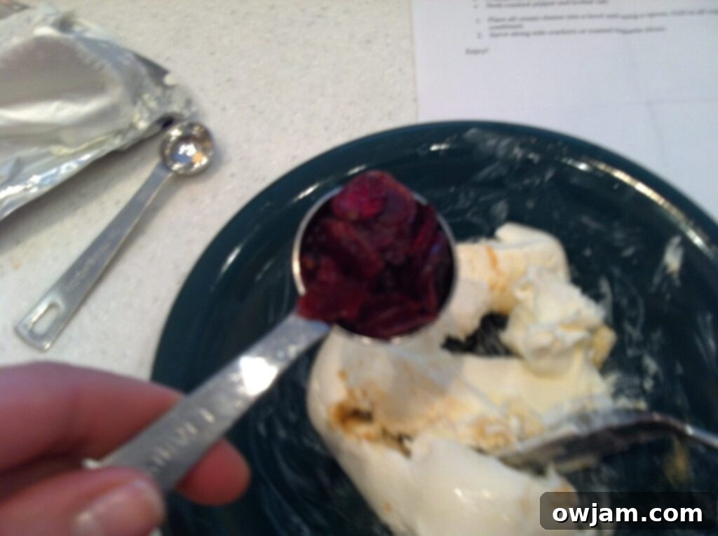 Dried cranberries and chopped rosemary added to cream cheese