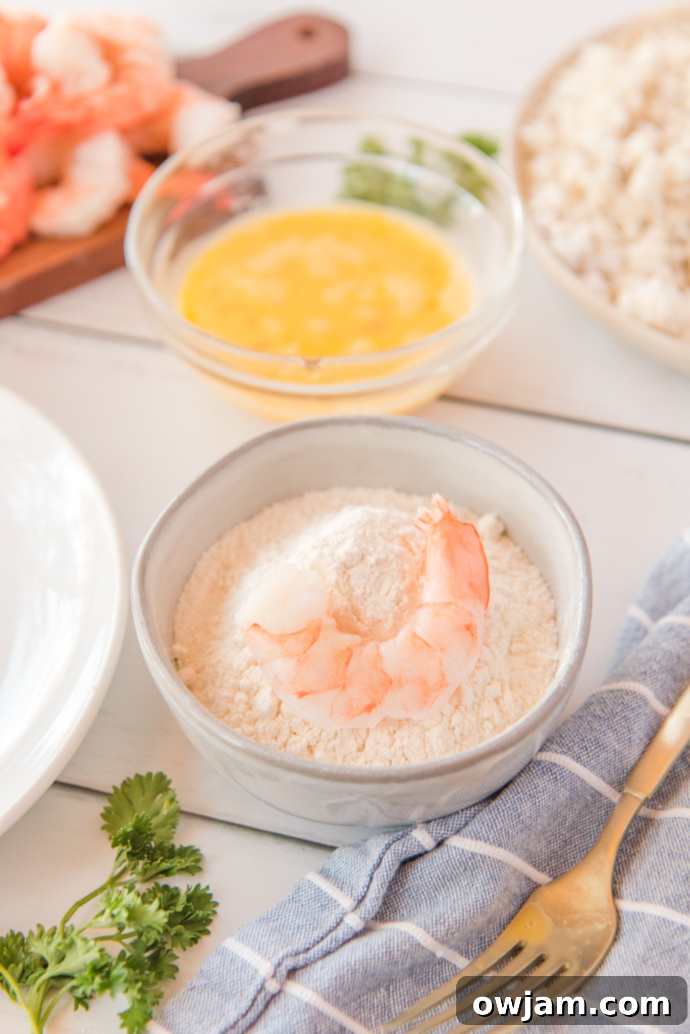 Golden Air Fryer Coconut Shrimp 9 Air Fryer Coconut Shrimp in coconut flakes.