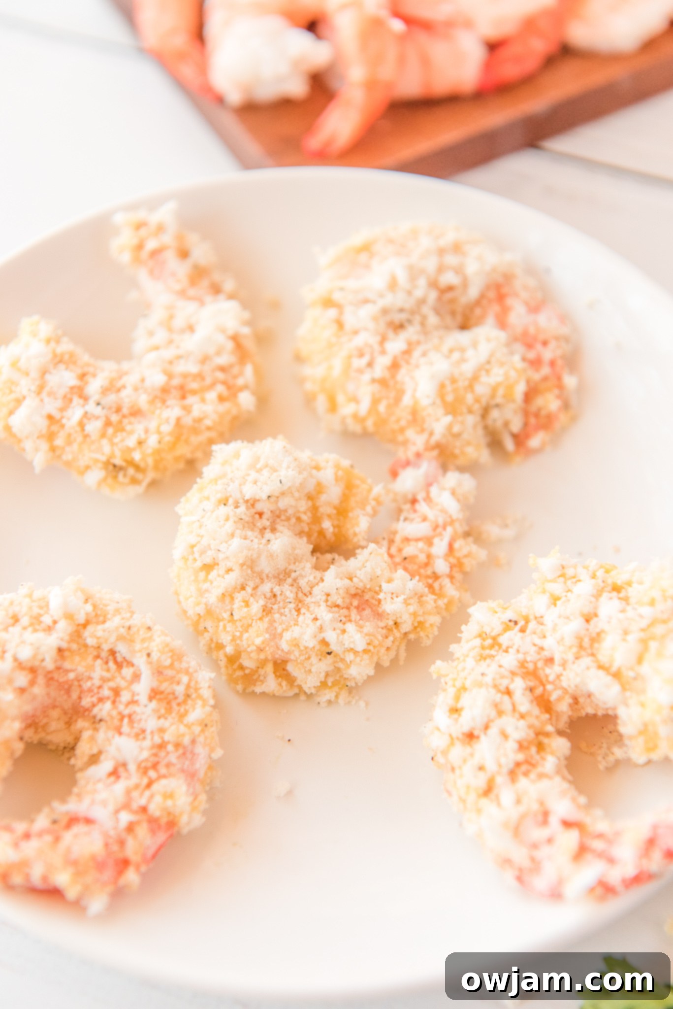 Golden Air Fryer Coconut Shrimp 10 Air Fryer Coconut Shrimp on a plate.