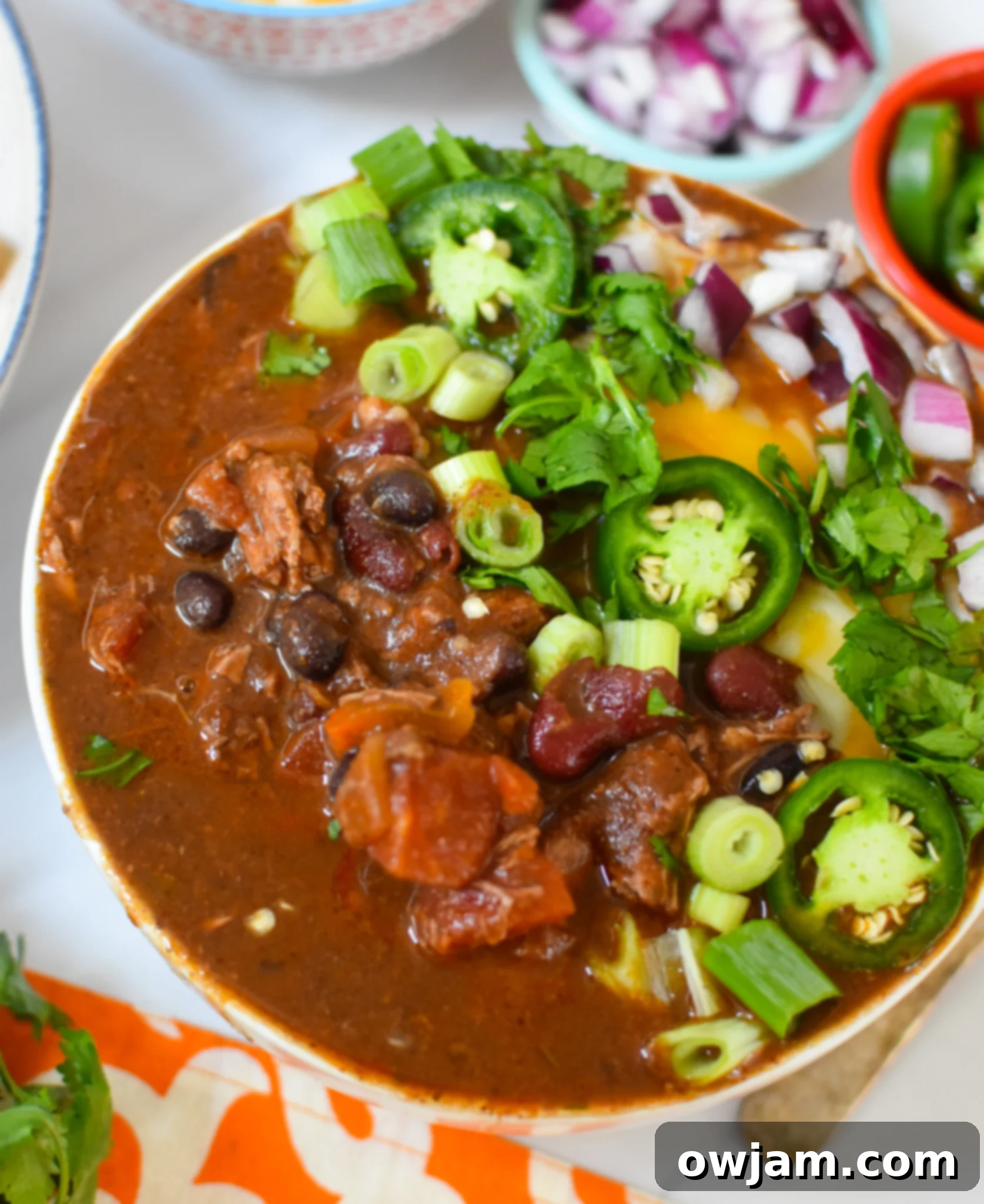Hearty Chili Con Carne 4 A bowl of Chili Con Carne garnished with fresh cilantro.