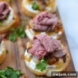 Caramelized Onion Beef Bites 12 Beef Crostini with Caramelized Onion and Goat Cheese, a close-up of a single crostini.