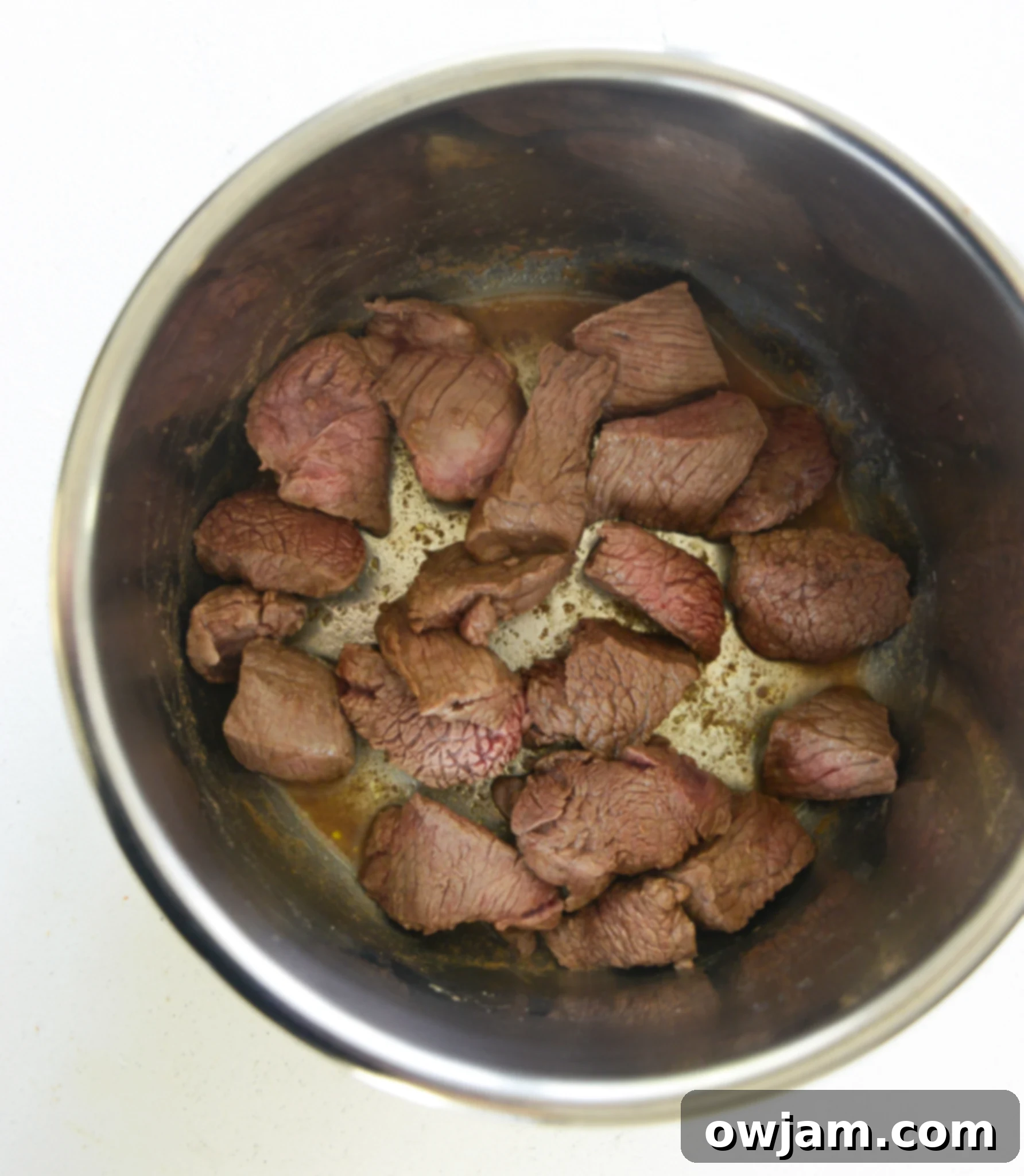 Easy Instant Pot Beef Stew 6 Instant Pot Beef Stew Recipe with browned beef in the Instant Pot, ready for the next steps.