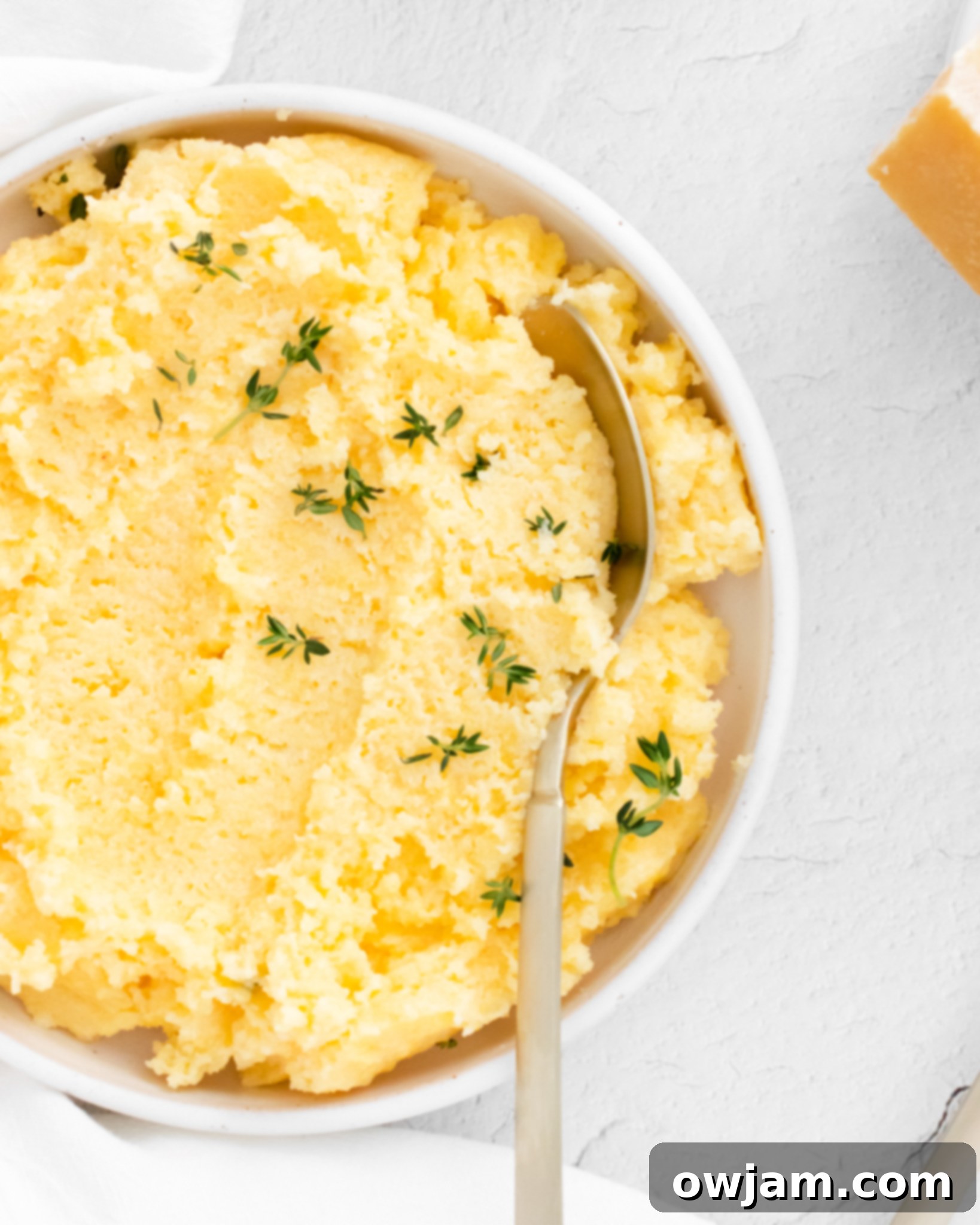 Silky Smooth Polenta Perfection 3 Creamy Polenta Recipe with a spoon.