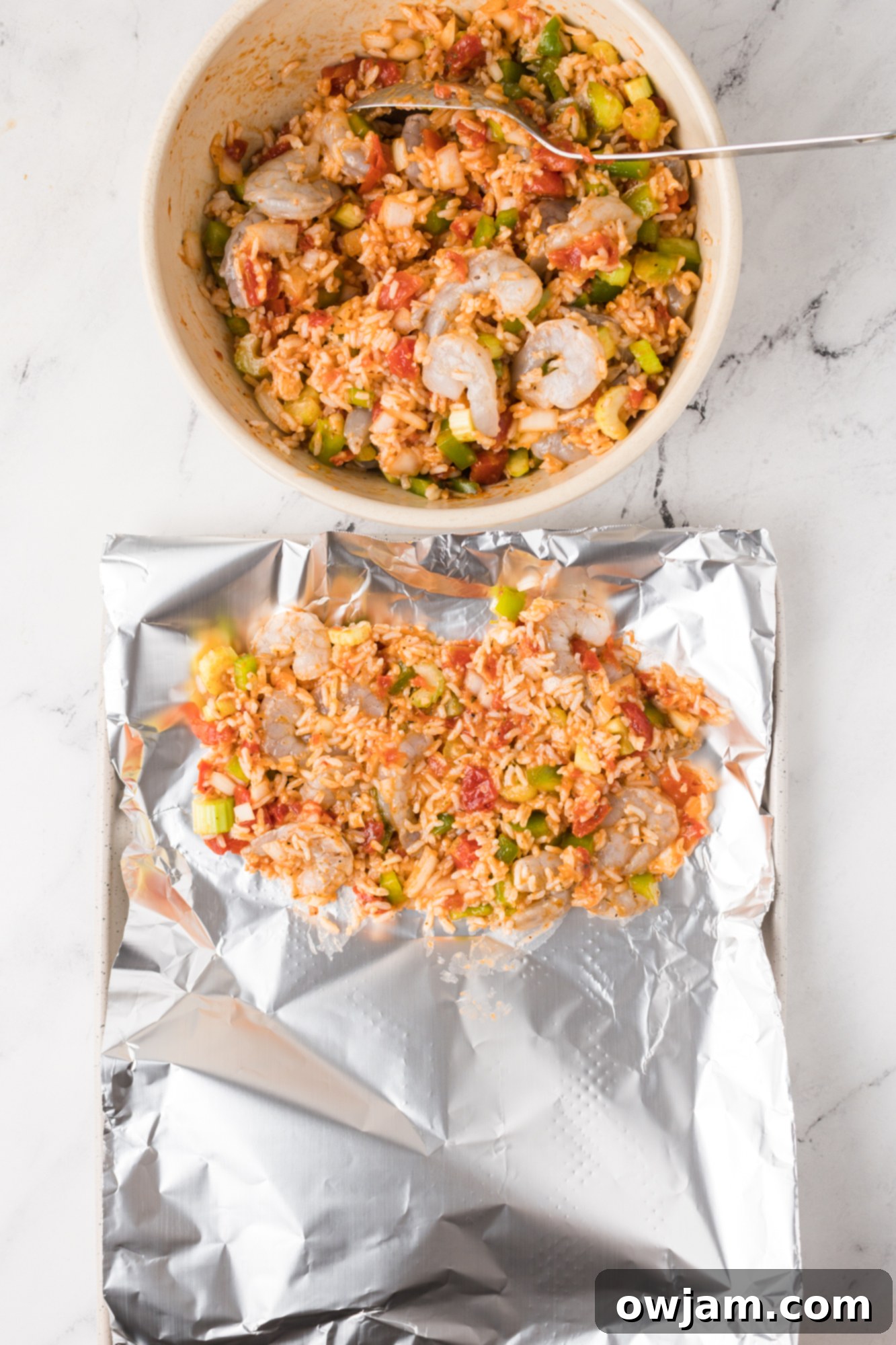 Foil packet with Shrimp Creole mixture, ready to be sealed.