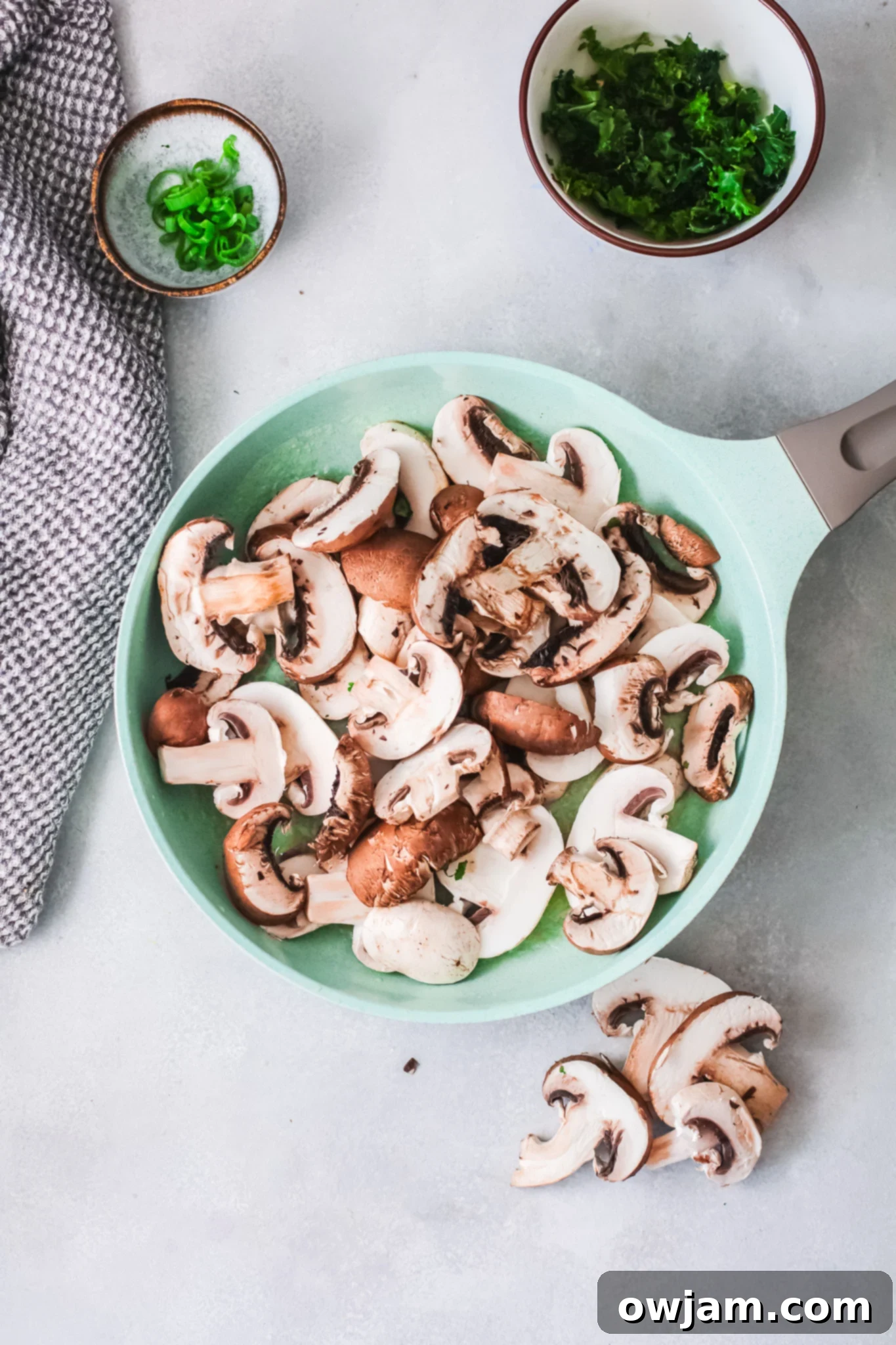 Delicious Korean Noodles in Minutes 6 Sliced mushrooms cooking in a skillet for Korean Noodles.