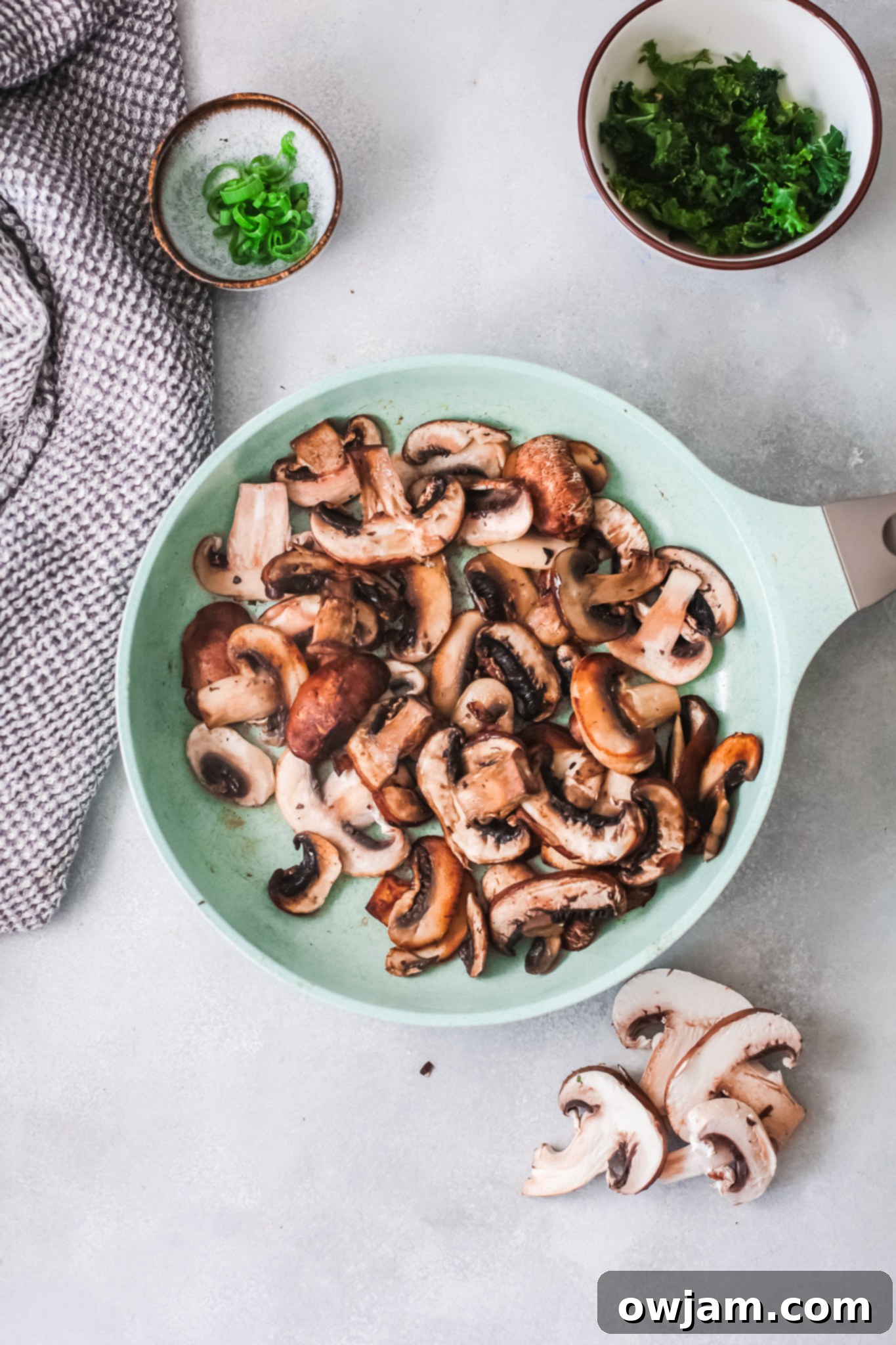 Delicious Korean Noodles in Minutes 7 Caramelized mushrooms in a skillet for Easy Korean Noodles.