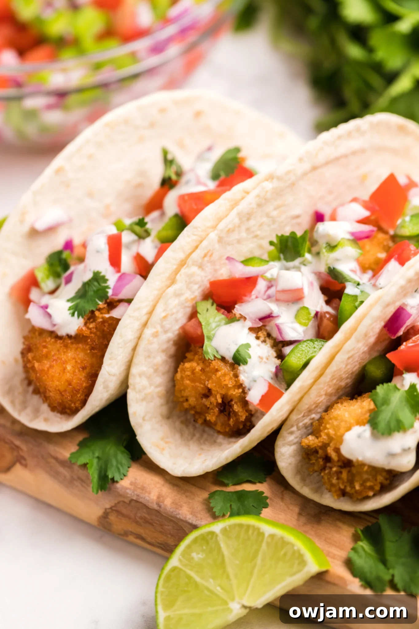 Tilapia Fish Taco Recipe with fresh salsa and lime aioli.