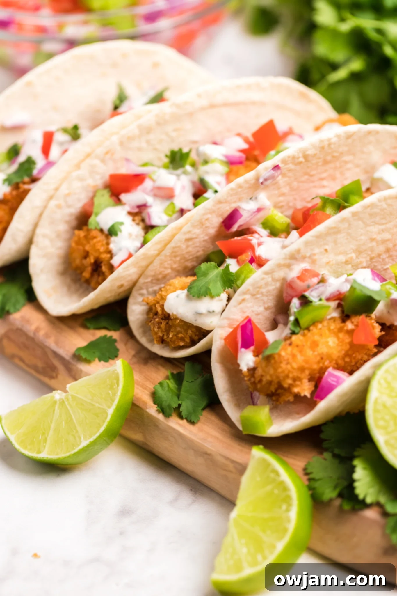 Assembled Tilapia Fish Tacos in warm corn tortillas.