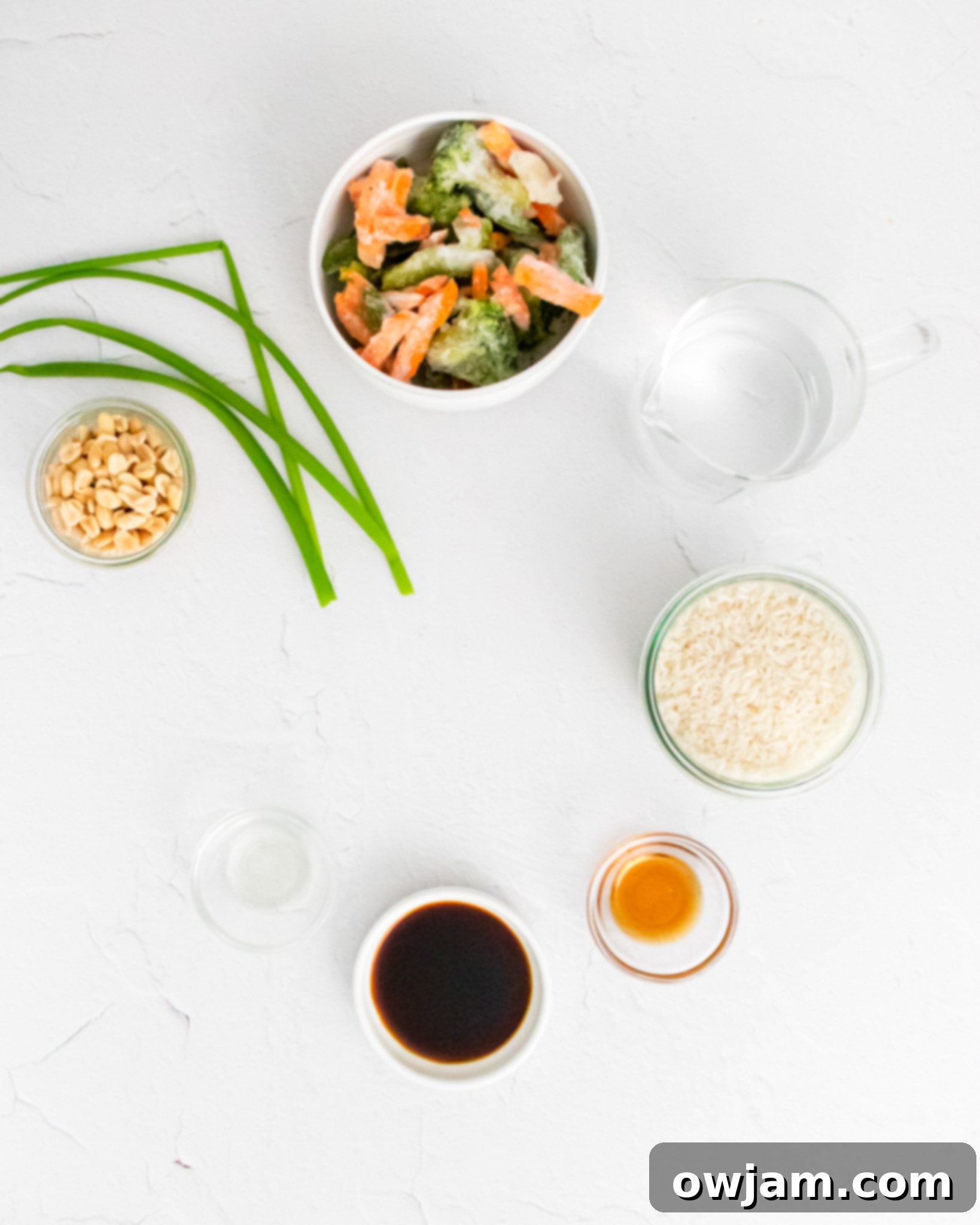 Effortless Instant Pot Fried Rice 3 A selection of Instant Pot Fried Rice ingredients laid out on a table.