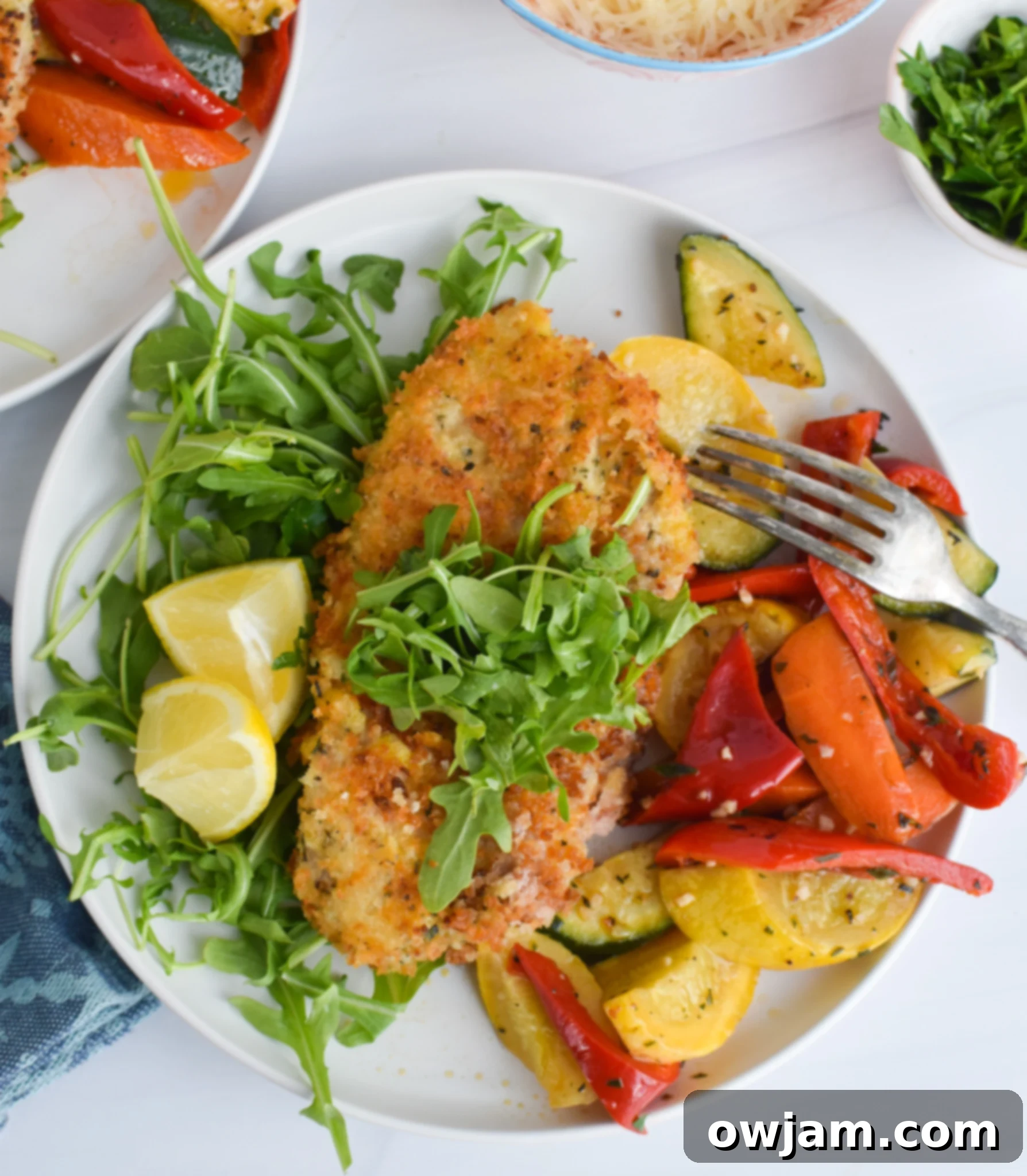 Effortless Homemade Veal Milanese 4 Crispy Easy Veal Milanese Recipe served with fresh vegetables.