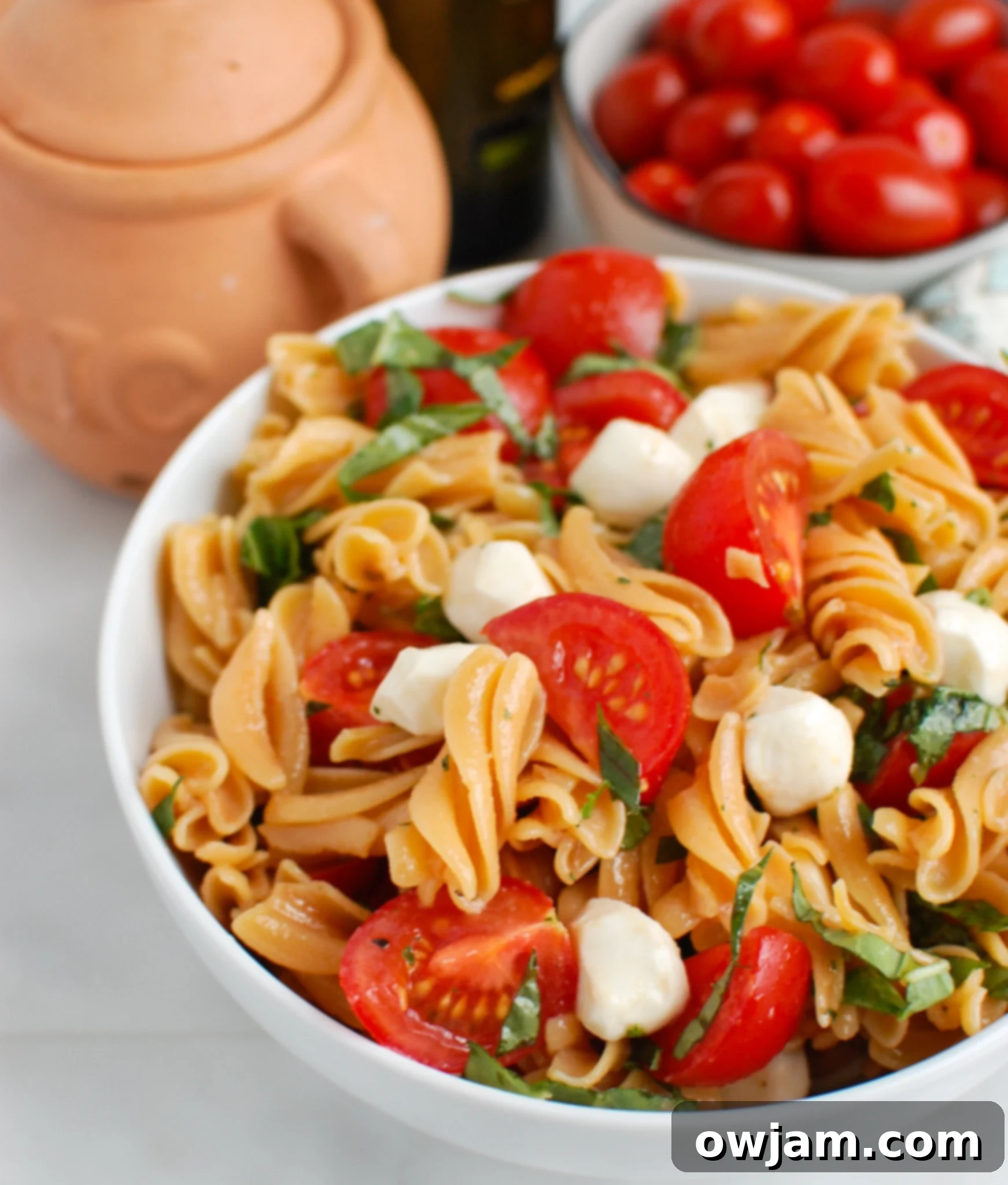 Caprese Pasta in white bowl