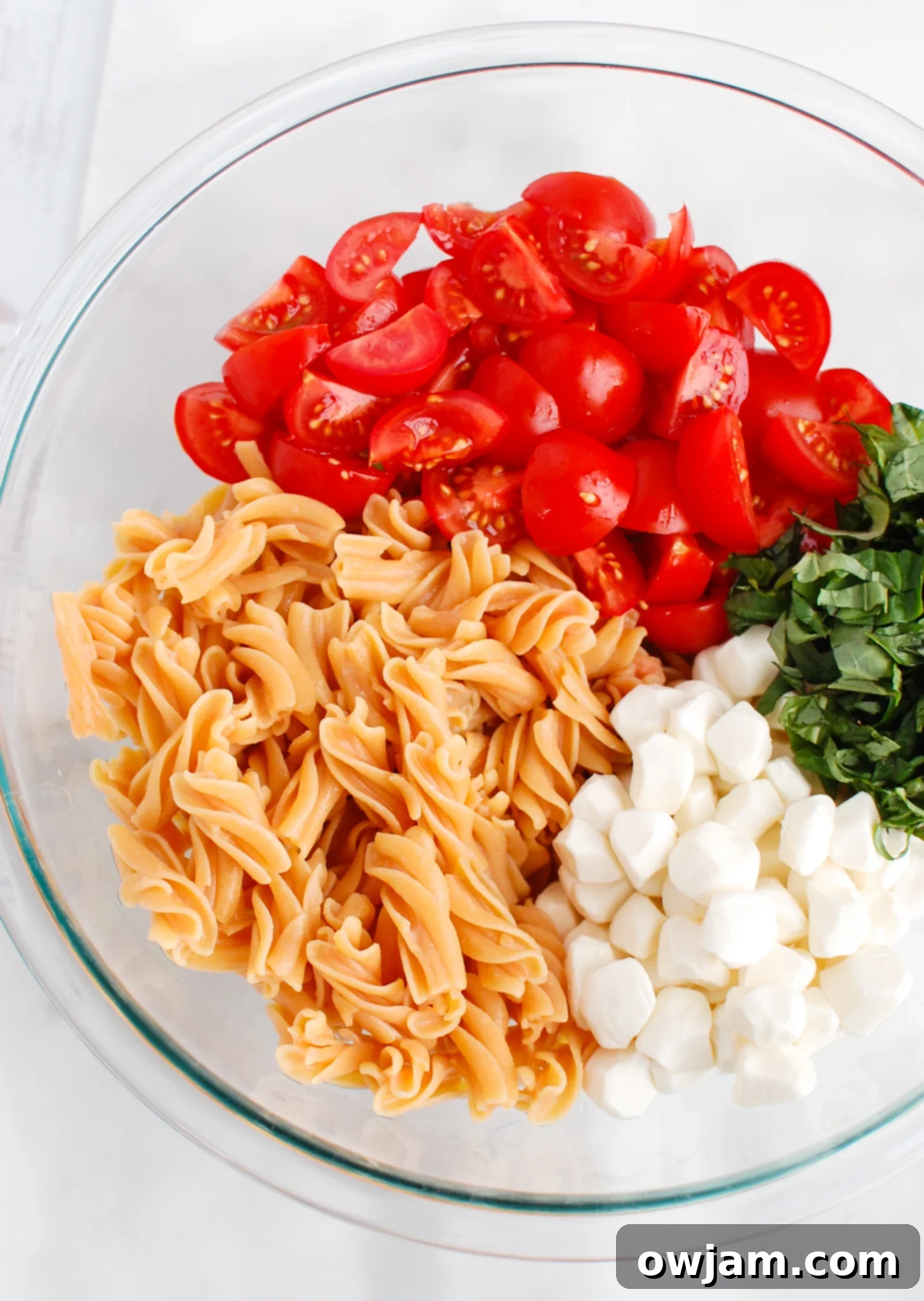 Caprese Pasta ingredients in a bowl.