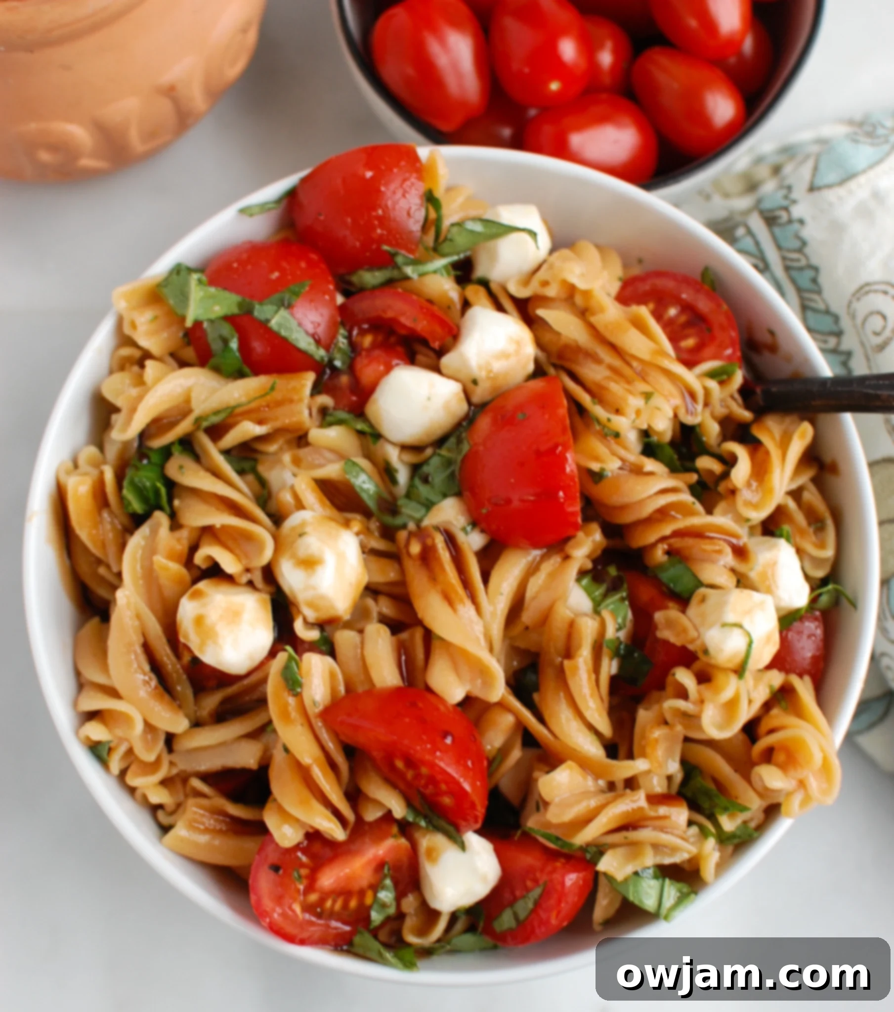 Caprese Pasta with spoon