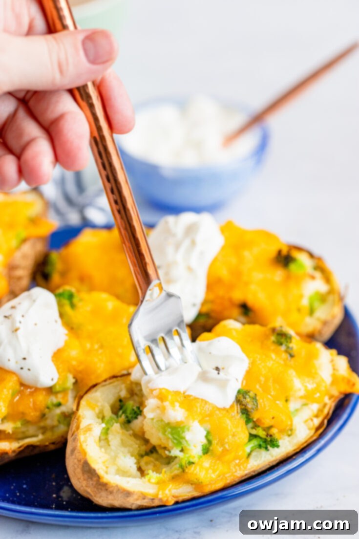 Fluffy Air Fryer Twice Baked Potato stuffed with broccoli and cheese, a hearty steak side.