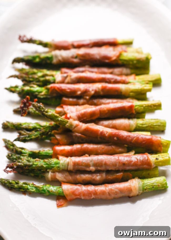 Elegant Prosciutto Wrapped Asparagus, a delicious and quick vegetable side.