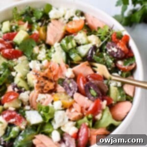 Mediterranean Salmon Delight 8 Mediterranean Salmon Bowl in a white bowl with a gold fork