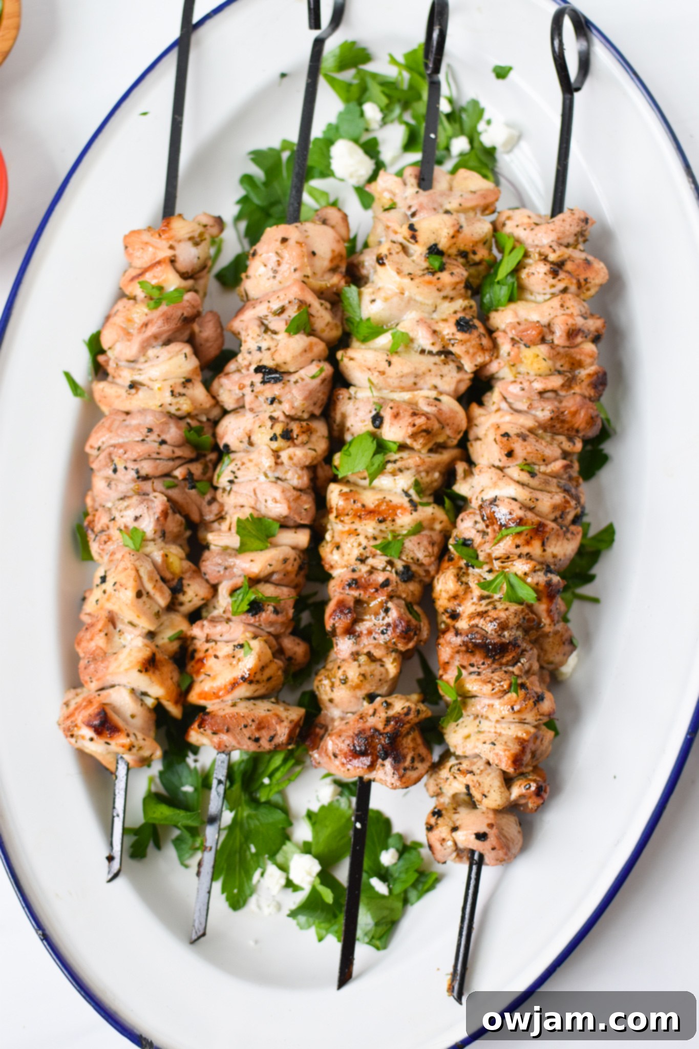 Perfect Homemade Chicken Souvlaki 2 Chicken Souvlaki Recipe on a white platter.