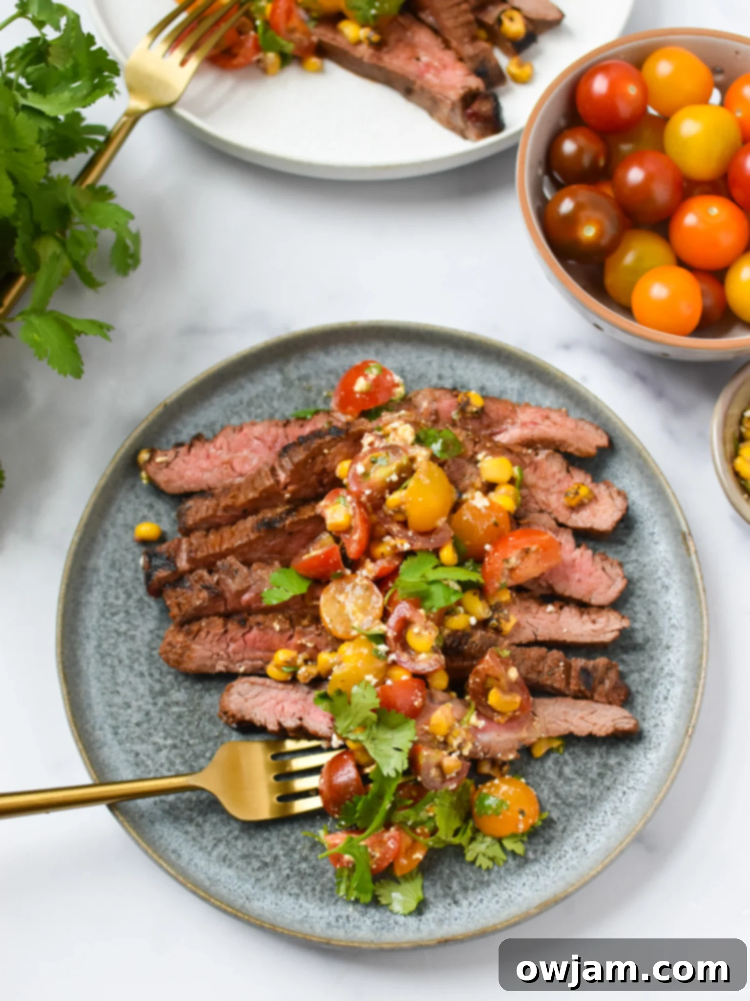 Grilled Flank Steak with Dry Rub on blue plate. 