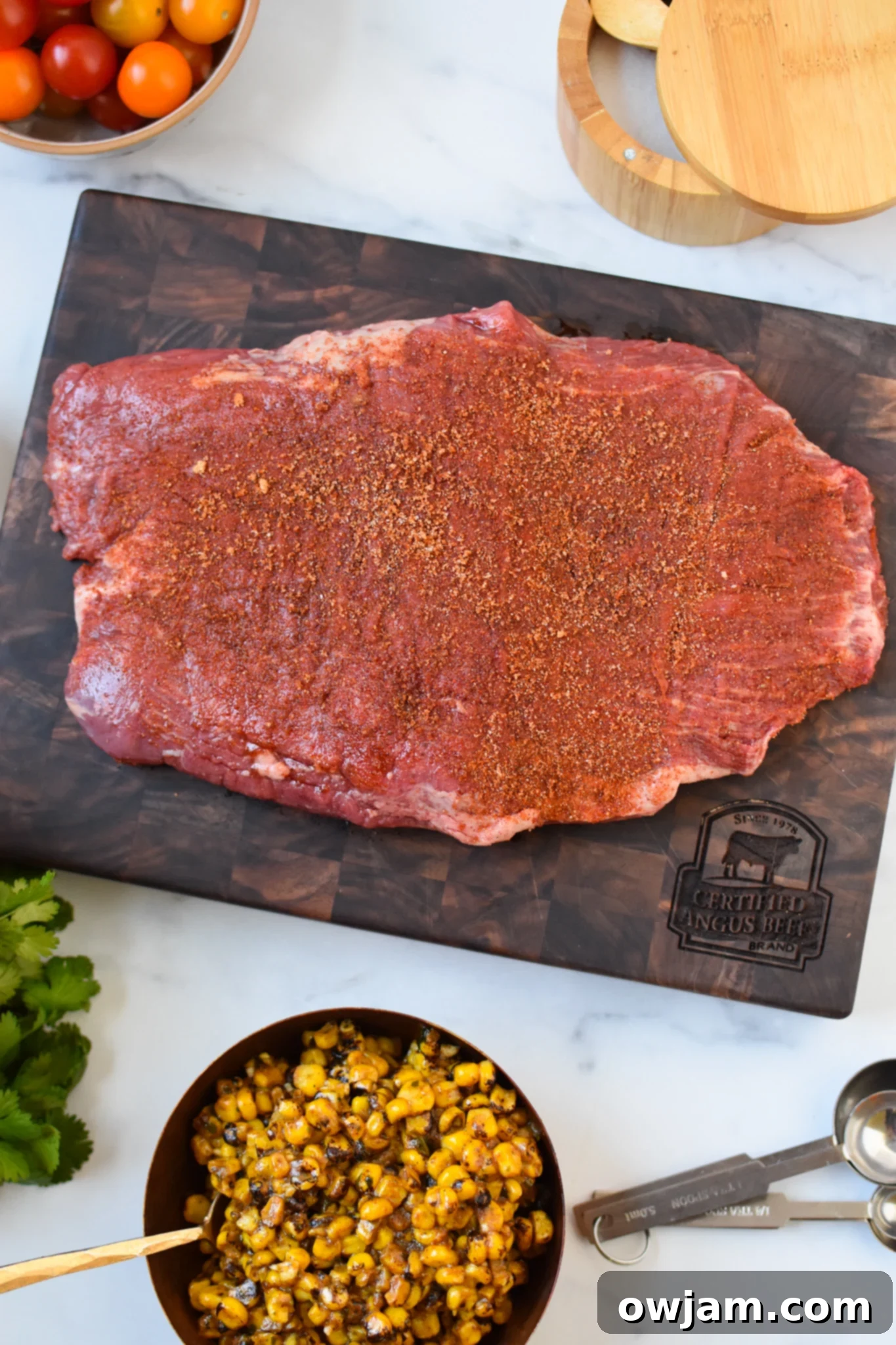 Grilled Flank Steak with Dry Rub on a cutting board. 