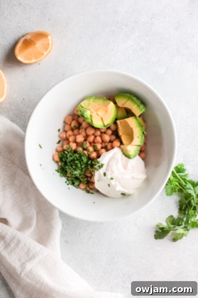 The Perfect Easy Chickpea Salad Sandwich 5 Chickpea Salad Sandwich ingredients in a bowl before mashing.