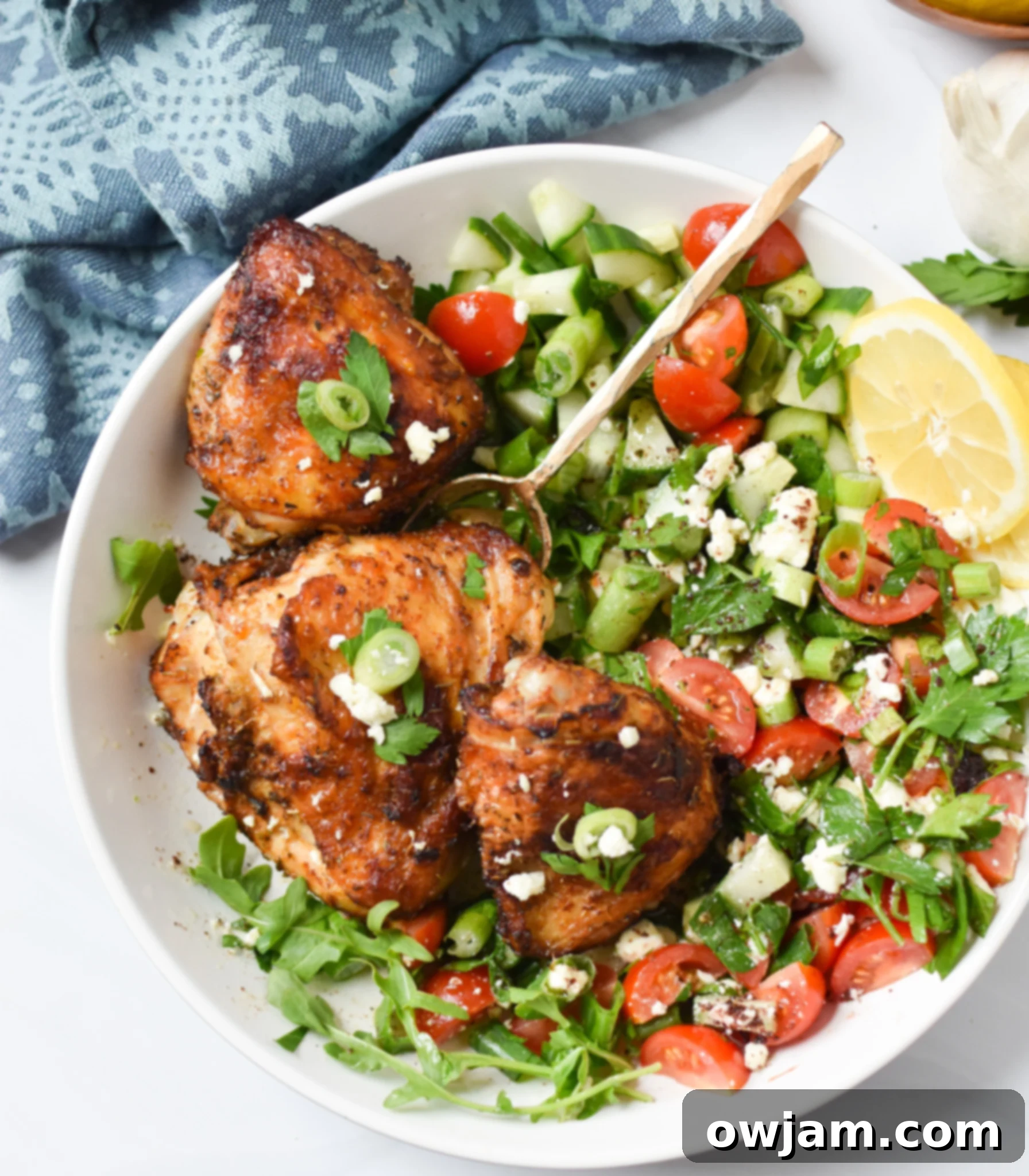 Bowl of Air Fryer Mediterranean Chicken Thighs marinating.