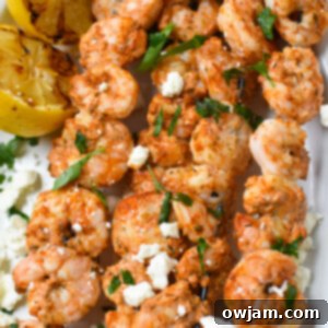 Mediterranean Grilled Shrimp Skewers on a white platter.