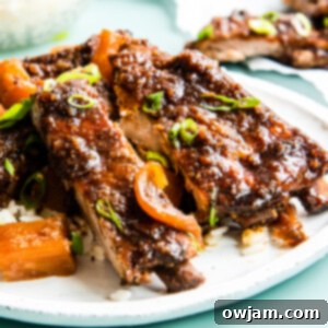 Aloha Slow Cooker Pork Ribs 11 Slow Cooker Hawaiian Pork Ribs on plate.
