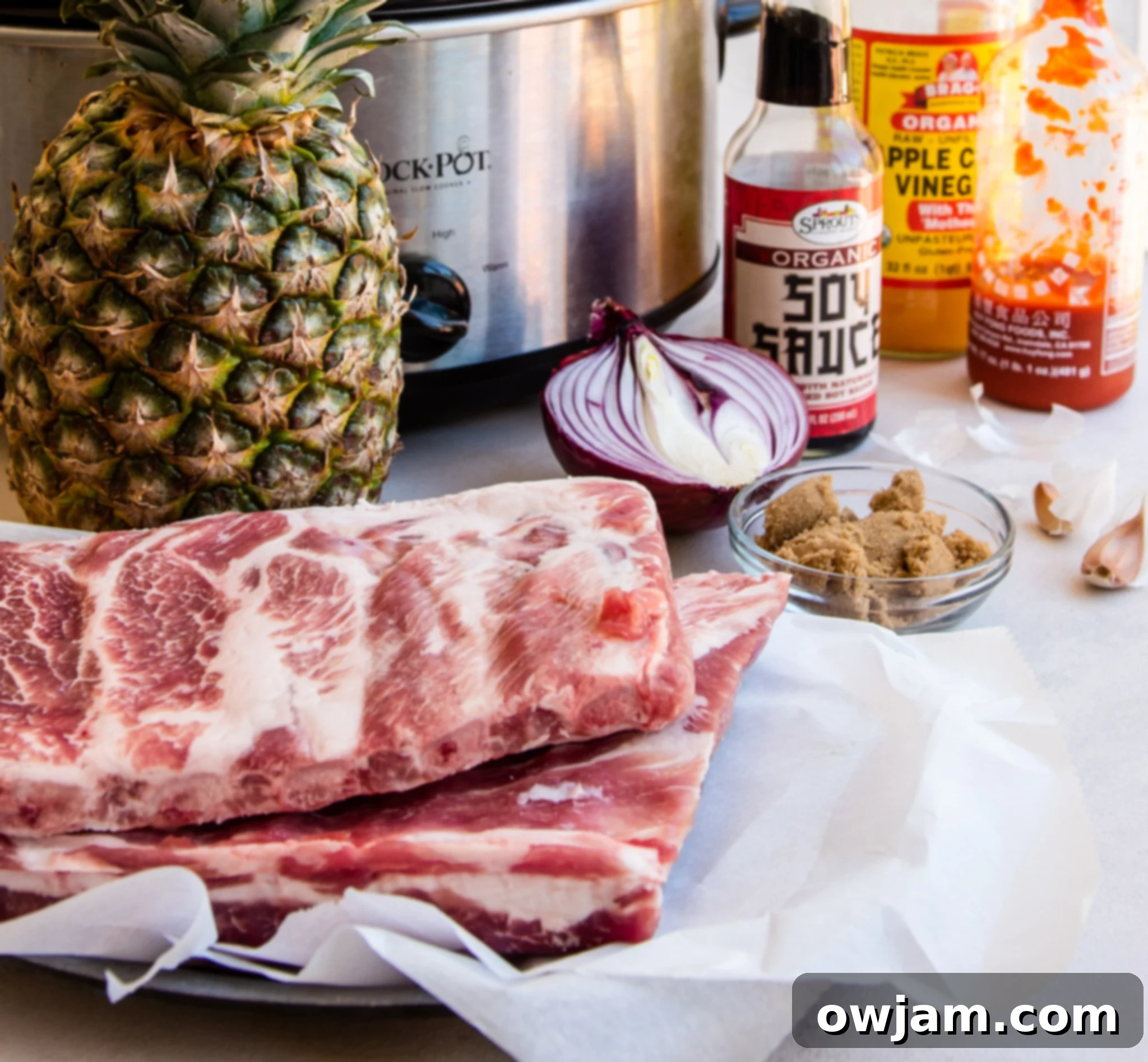 Aloha Slow Cooker Pork Ribs 3 Ingredients for Slow Cooker Hawaiian Pork Ribs laid out on a table.