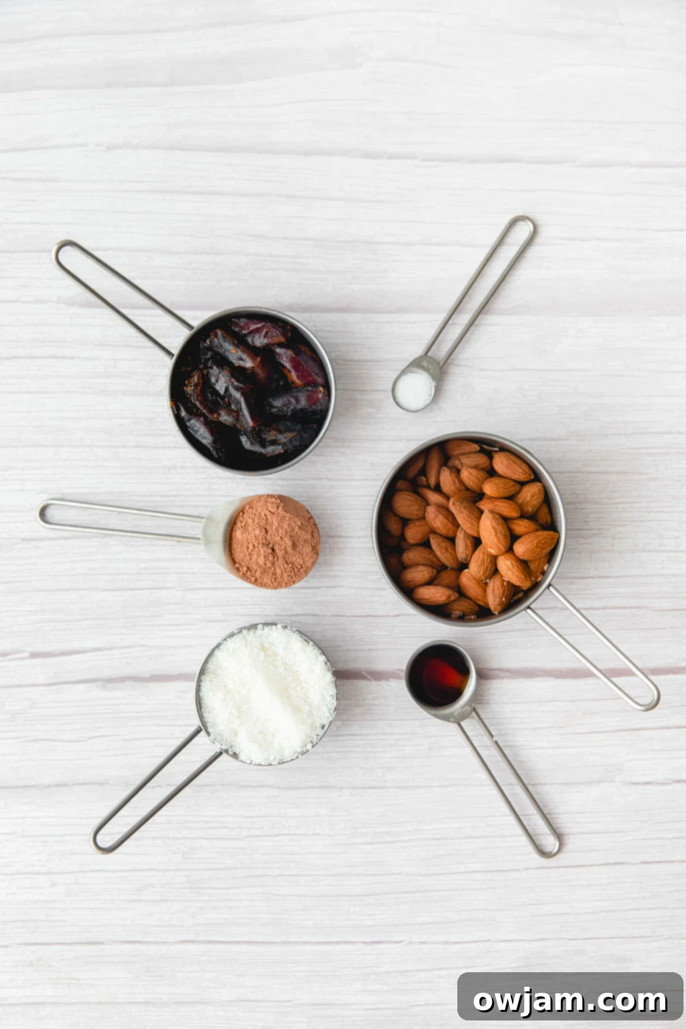 No-Bake Date Energy Bites 3 Individual ingredients for Easy Date Protein Balls laid out on a table, including dates, almonds, and coconut.