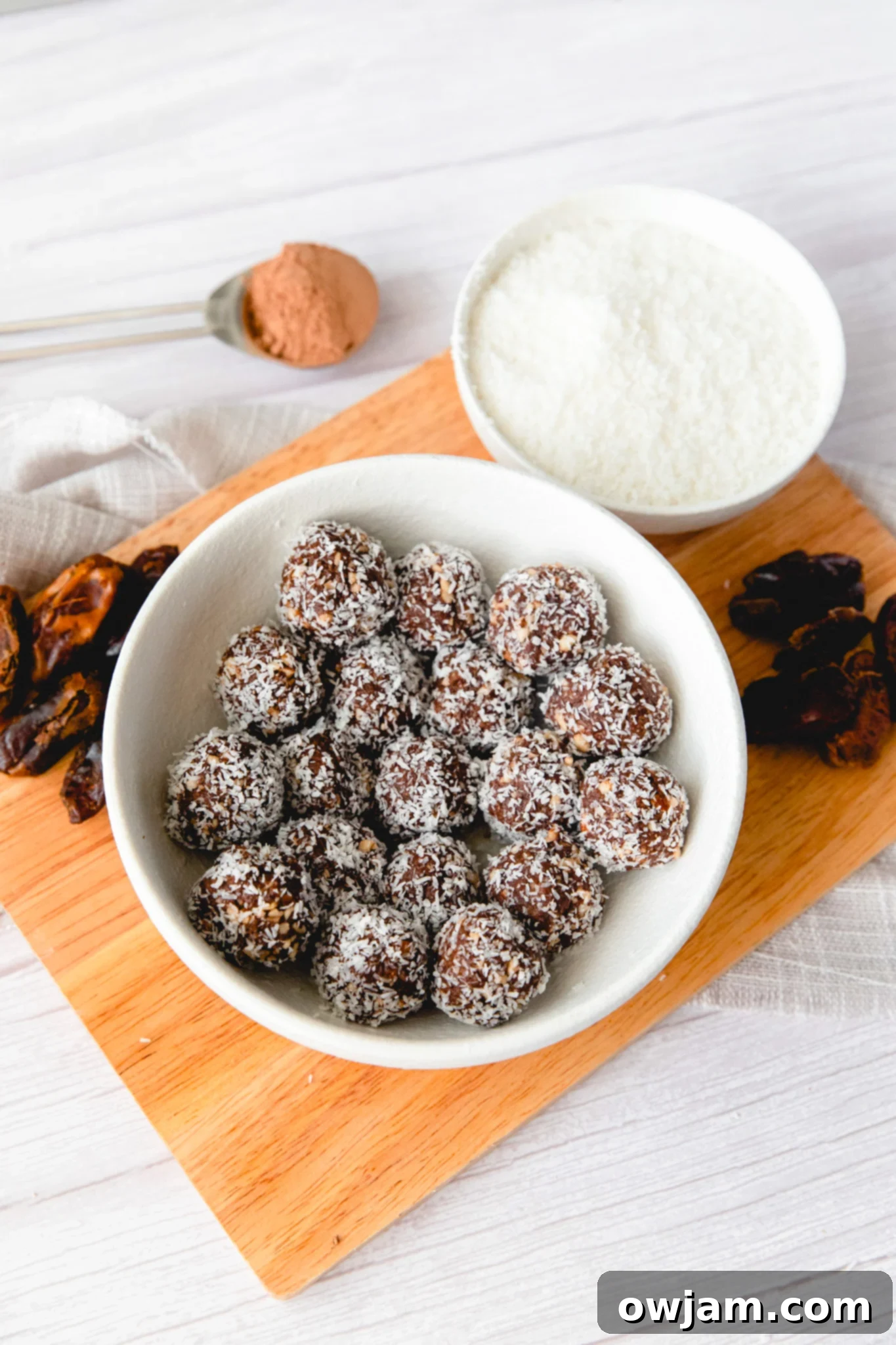 No-Bake Date Energy Bites 4 Easy Date Protein Balls mixture with coconut in a bowl before rolling.