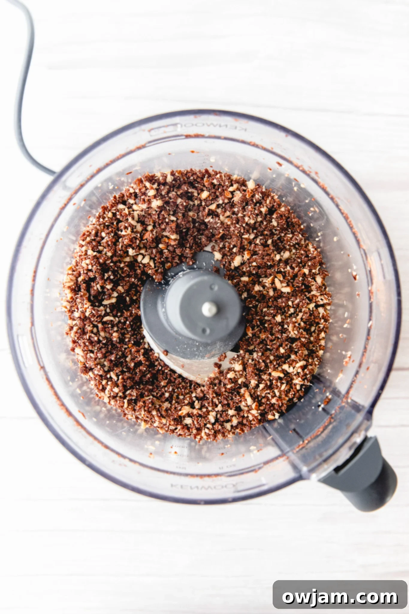 No-Bake Date Energy Bites 6 Blended mixture for Easy Date Protein Balls in a food processor, showing ideal consistency.