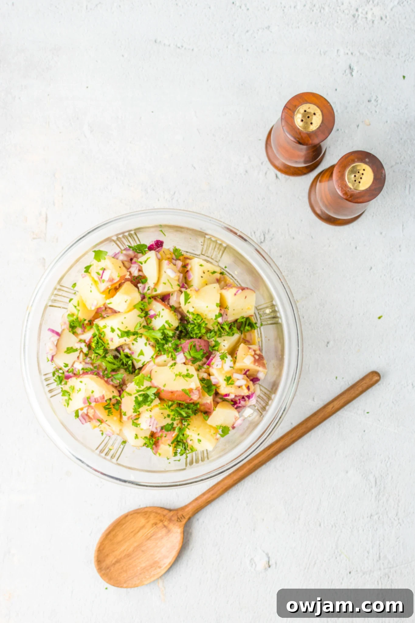 Ingredients for the zesty German Potato Salad dressing, including salt and pepper, ready to be combined.