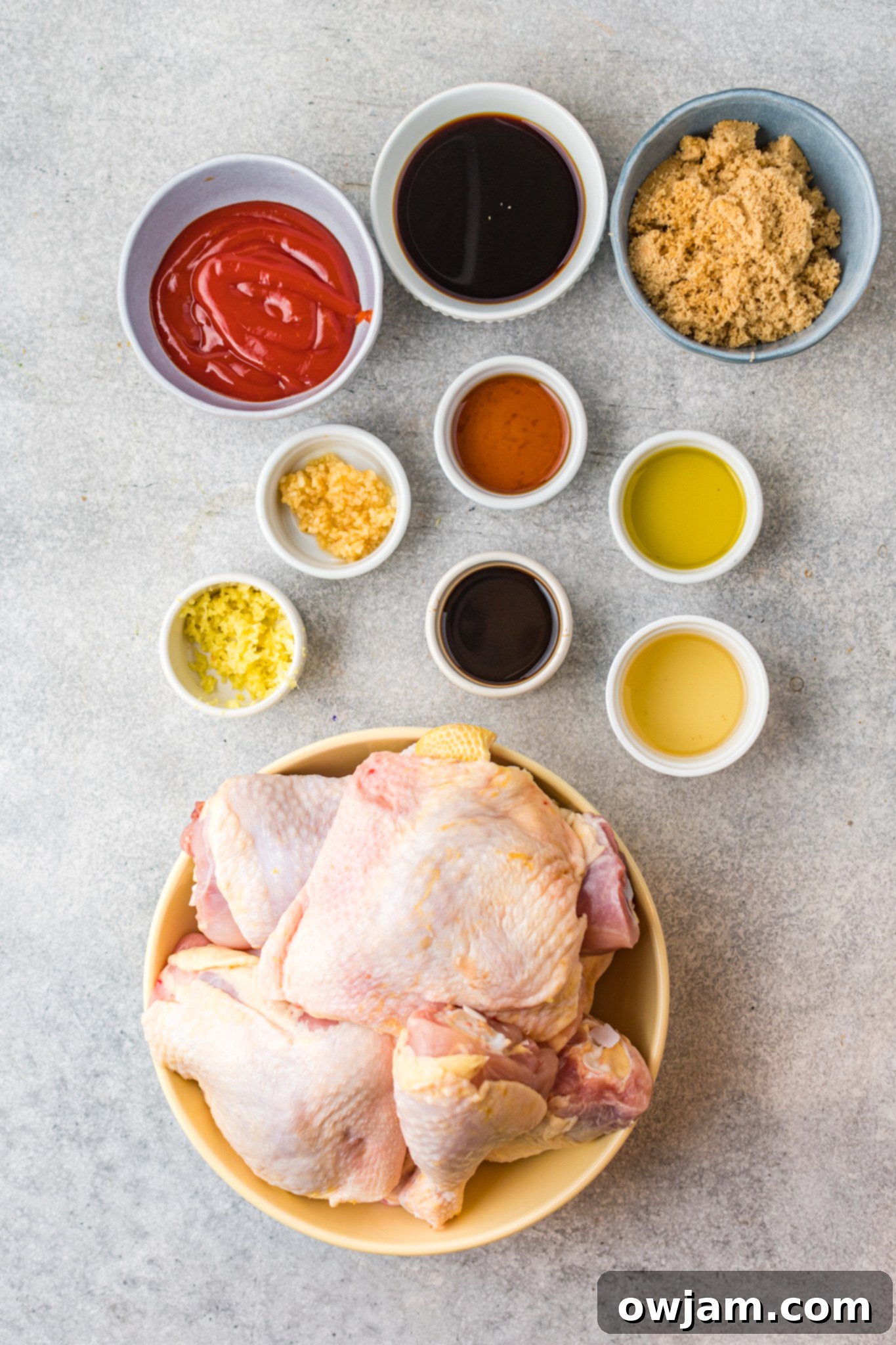 Hawaiian Fire Chicken 4 Assorted ingredients for Huli Huli Chicken marinade laid out, including soy sauce, ginger, garlic, brown sugar, and ketchup.