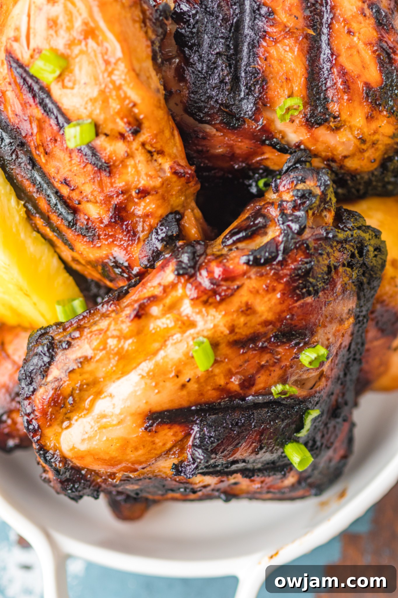 Hawaiian Fire Chicken 5 A platter of perfectly grilled Huli Huli chicken, showcasing its rich, caramelized crust.