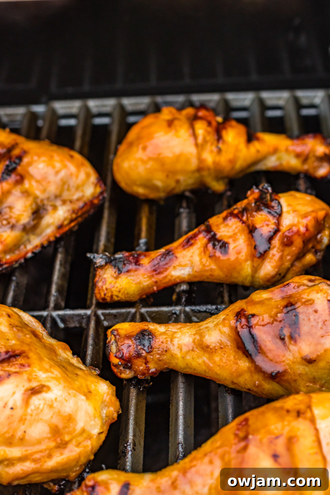 Hawaiian Fire Chicken 9 Multiple pieces of Huli Huli Chicken cooking evenly on the grill, showing a well-developed crust.