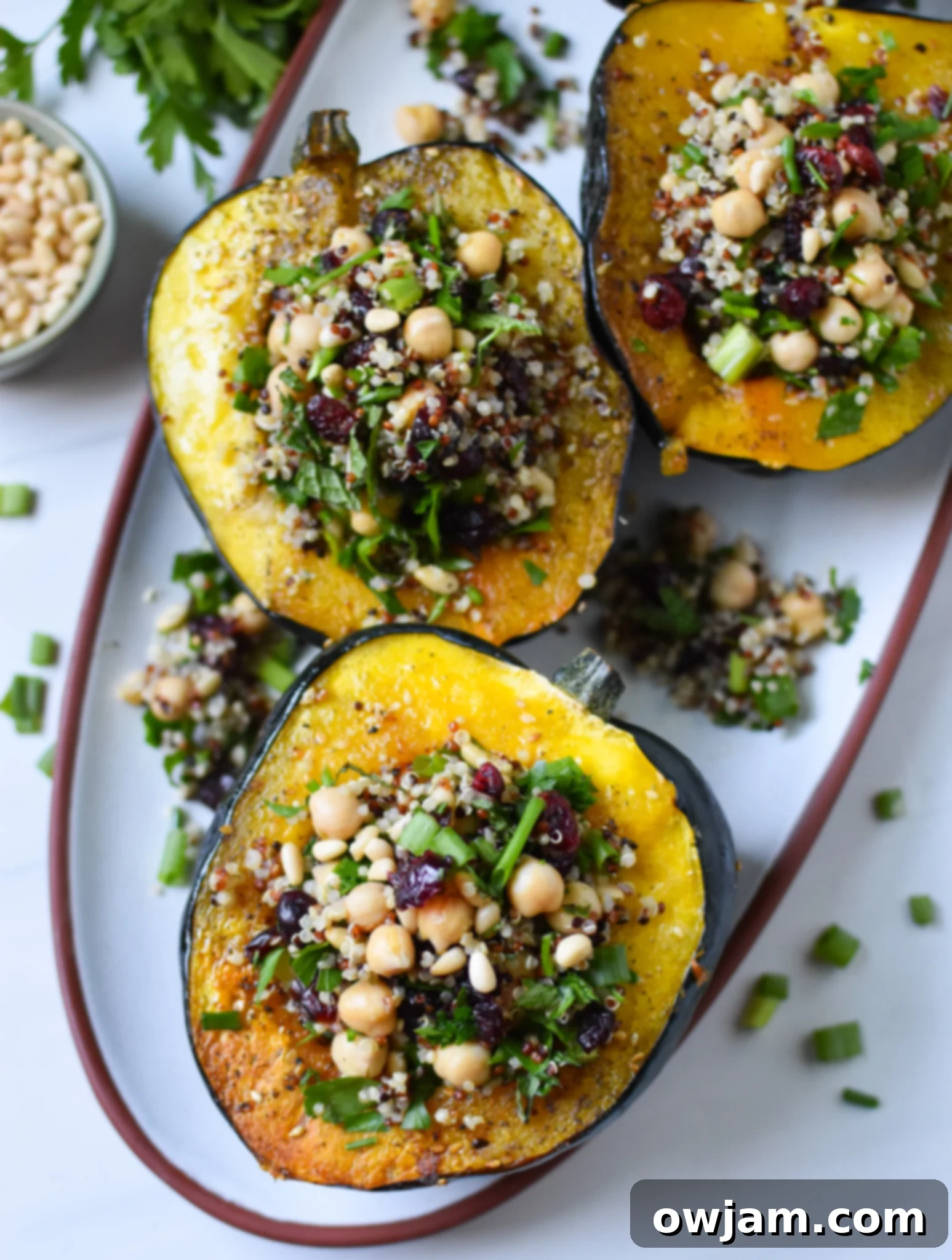 Sun-Drenched Stuffed Acorn Squash 4 Mediterranean Stuffed Acorn Squash on white plate.