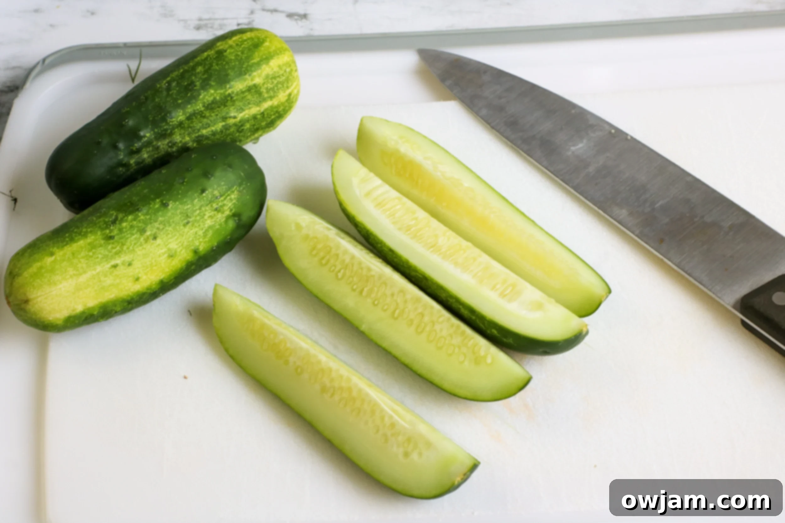 Refrigerator Dill Pickles on cutting board.