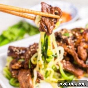 Bulgogi Zoodle Bowl 13 Beef Bulgogi with Zucchini Noodles with chopsticks.