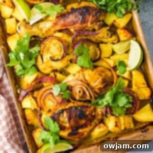 Close-up of a cooked Air Fryer Tandoori Chicken Leg, golden brown and garnished with herbs.