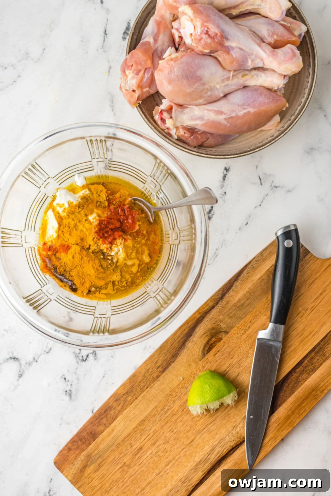 Air Fryer Tandoori Chicken Legs marinade in a bowl.