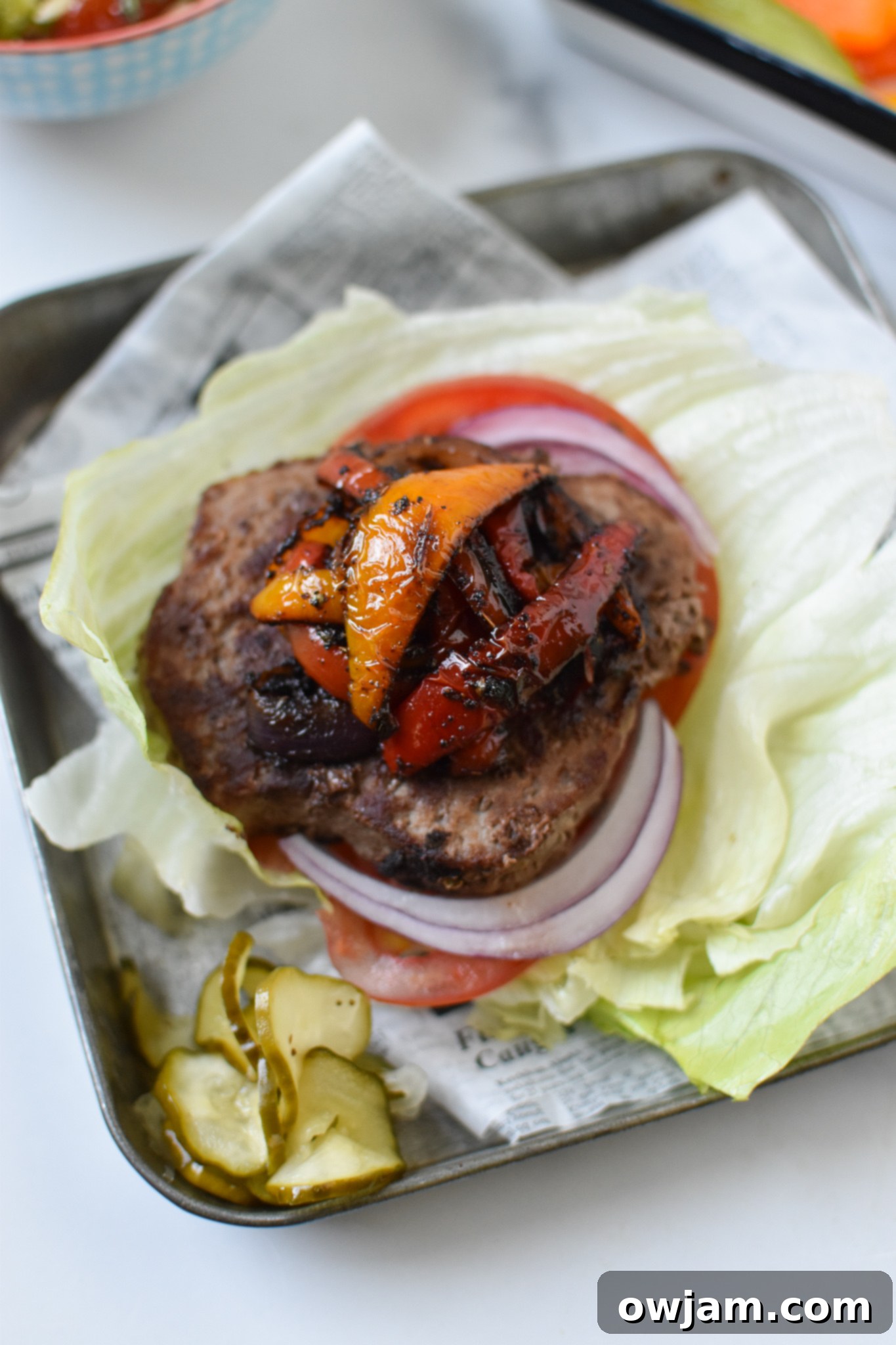 Close-up of Fajita Lettuce Burger with vibrant bell peppers and onions cooked to perfection, ready to be served.