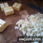 Chopped white chocolate pieces in a bowl, ready to be melted for the top layer of peppermint bark.