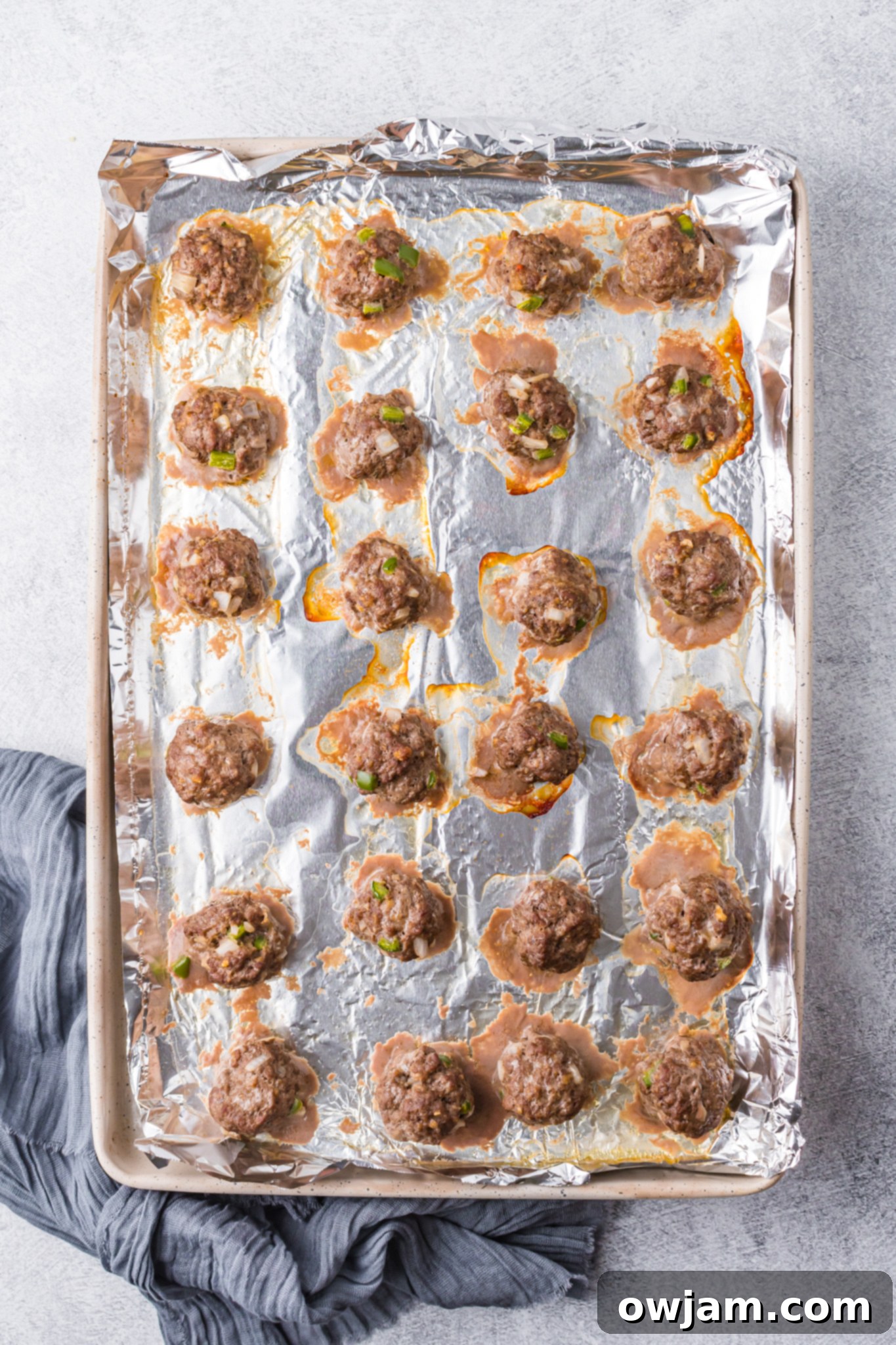 Flavorful Curry Meatballs 7 Curry Meatballs Recipe on a baking sheet.